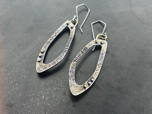 Open Progression earrings with golden accents